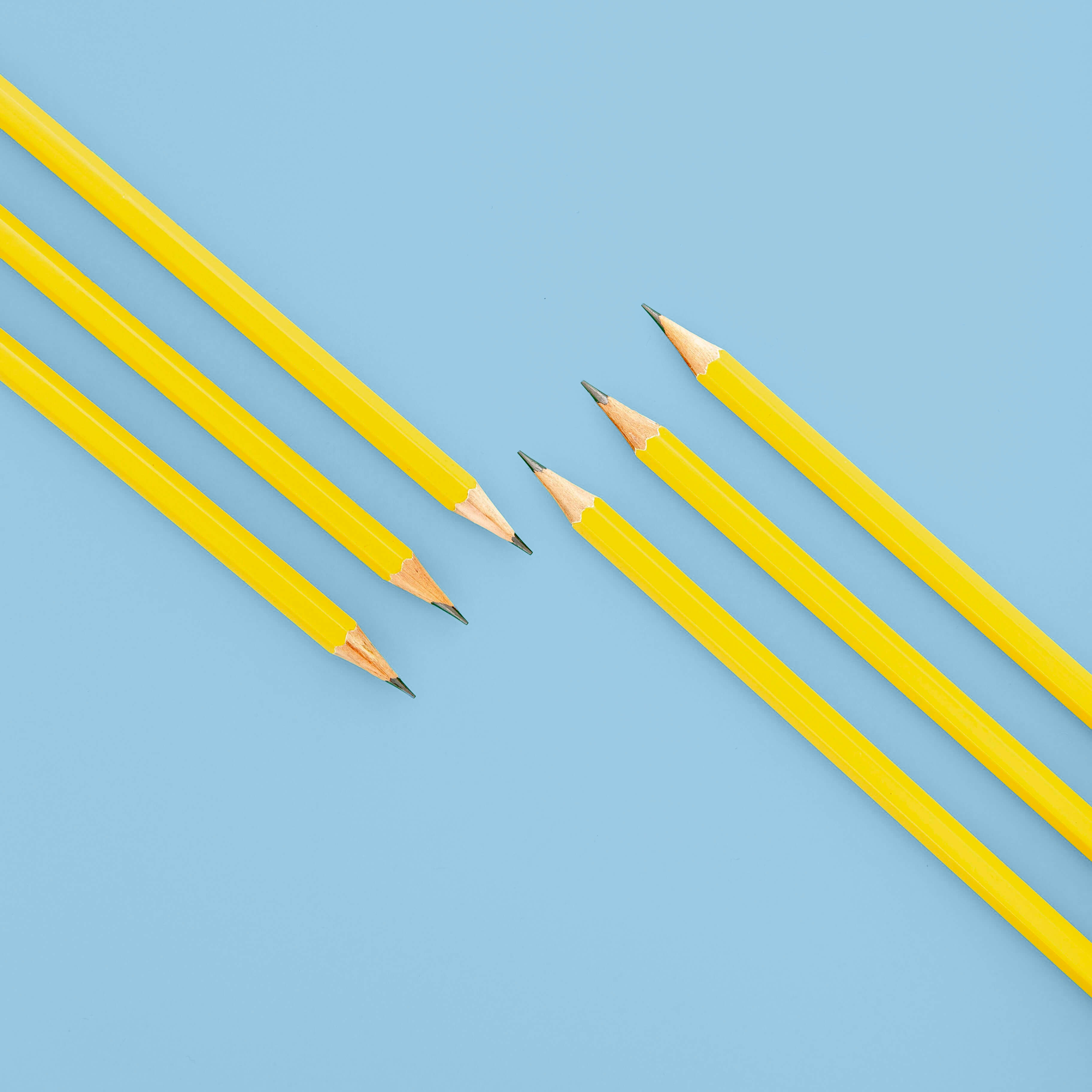 Yellow pencils on a blue background