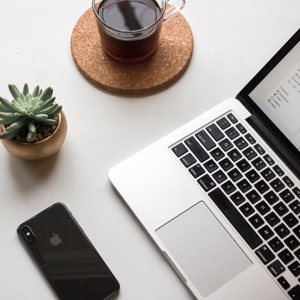 Laptop with coffee and cactus