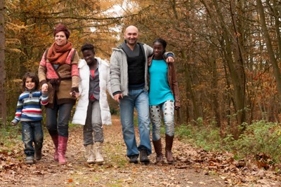 Family holding hands and walking 