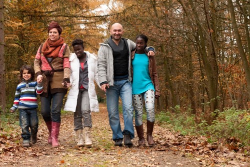 Family holding hands and walking 